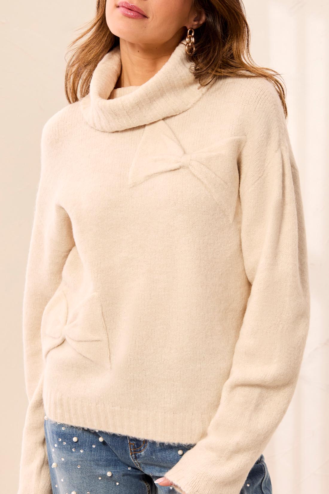 TRIBAL SWEATER WITH BOW ACCENTS